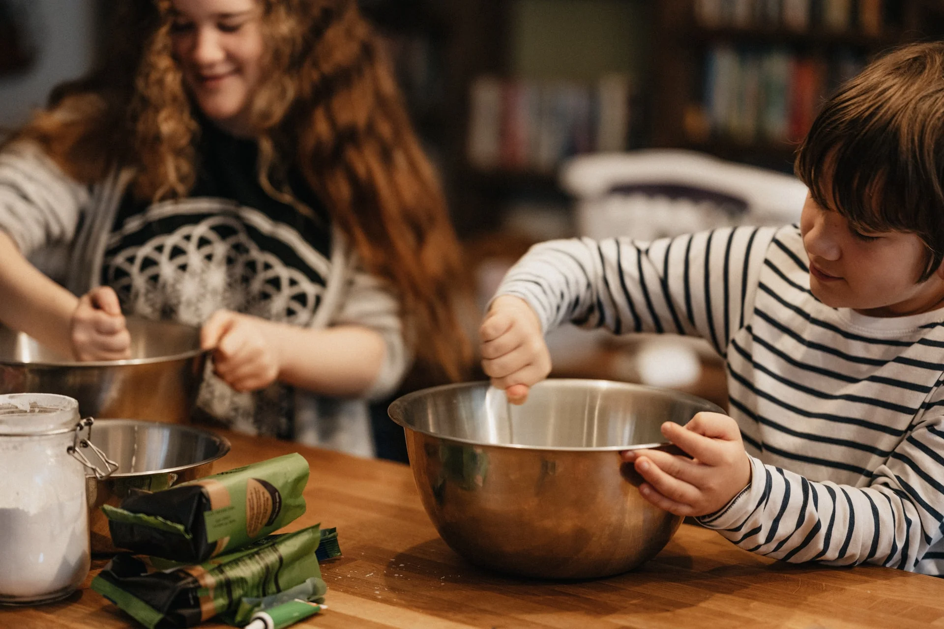 a person and a child preparing food