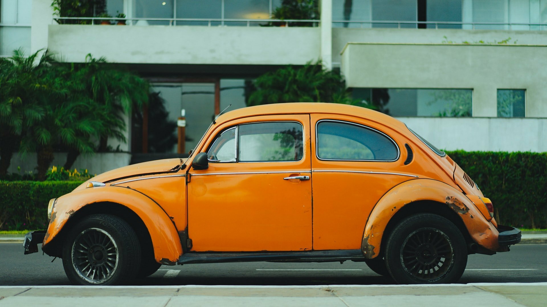 an orange car on the street