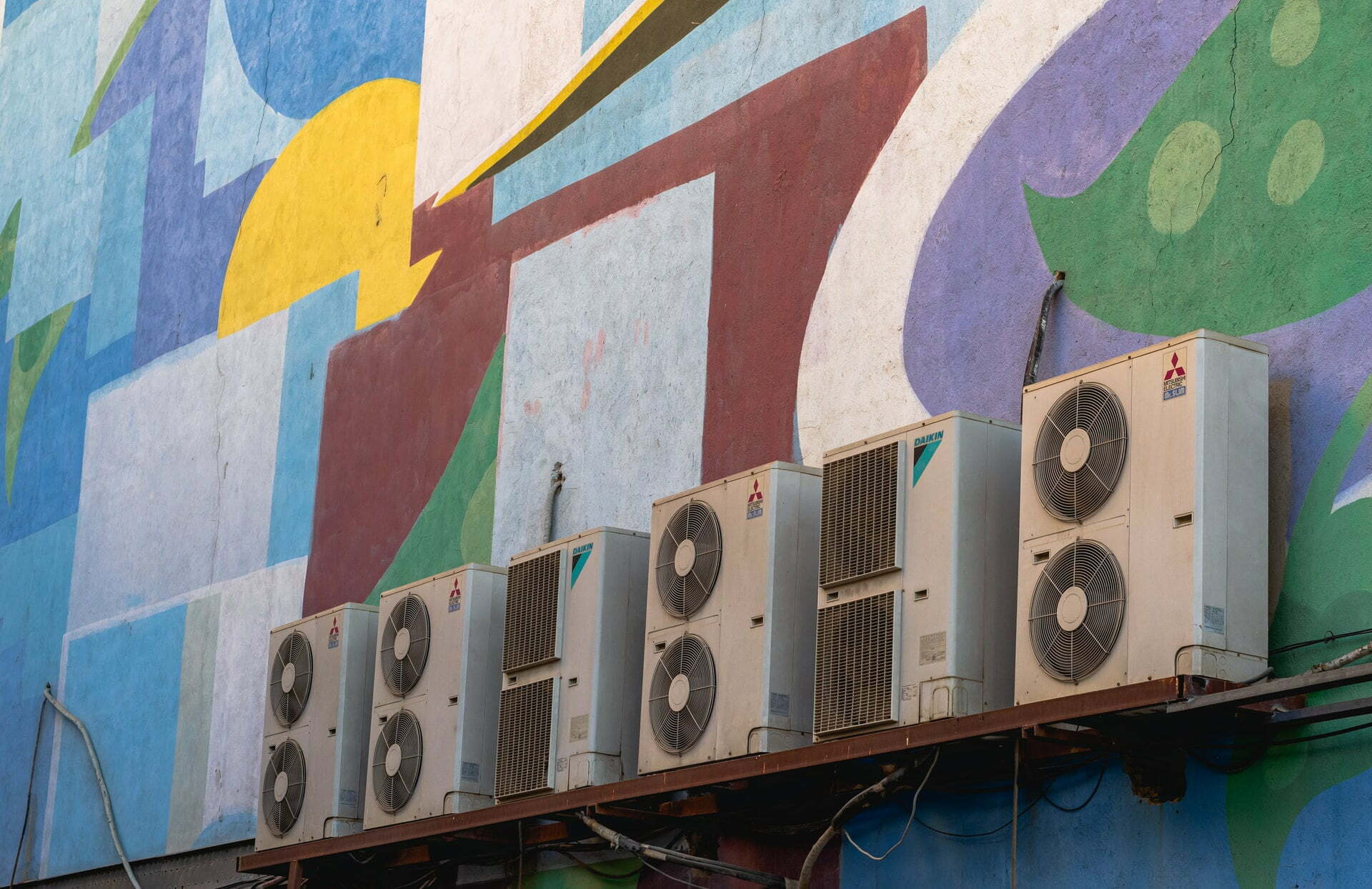 a large colorful wall with a large painting on it