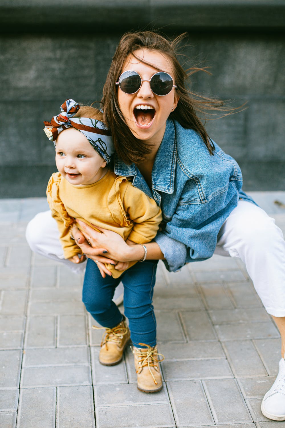 a woman holding a baby