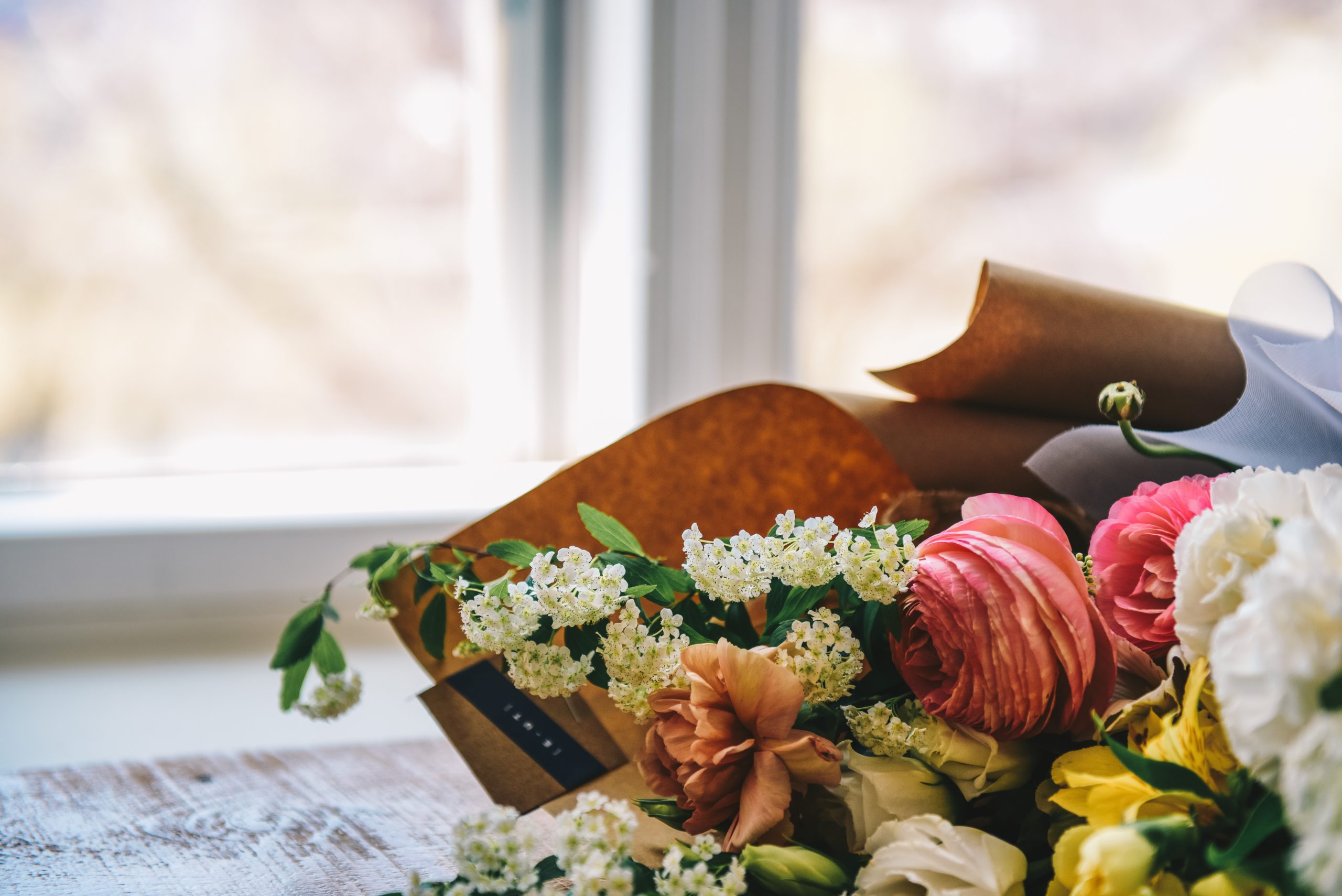 a person holding a bouquet of flowers