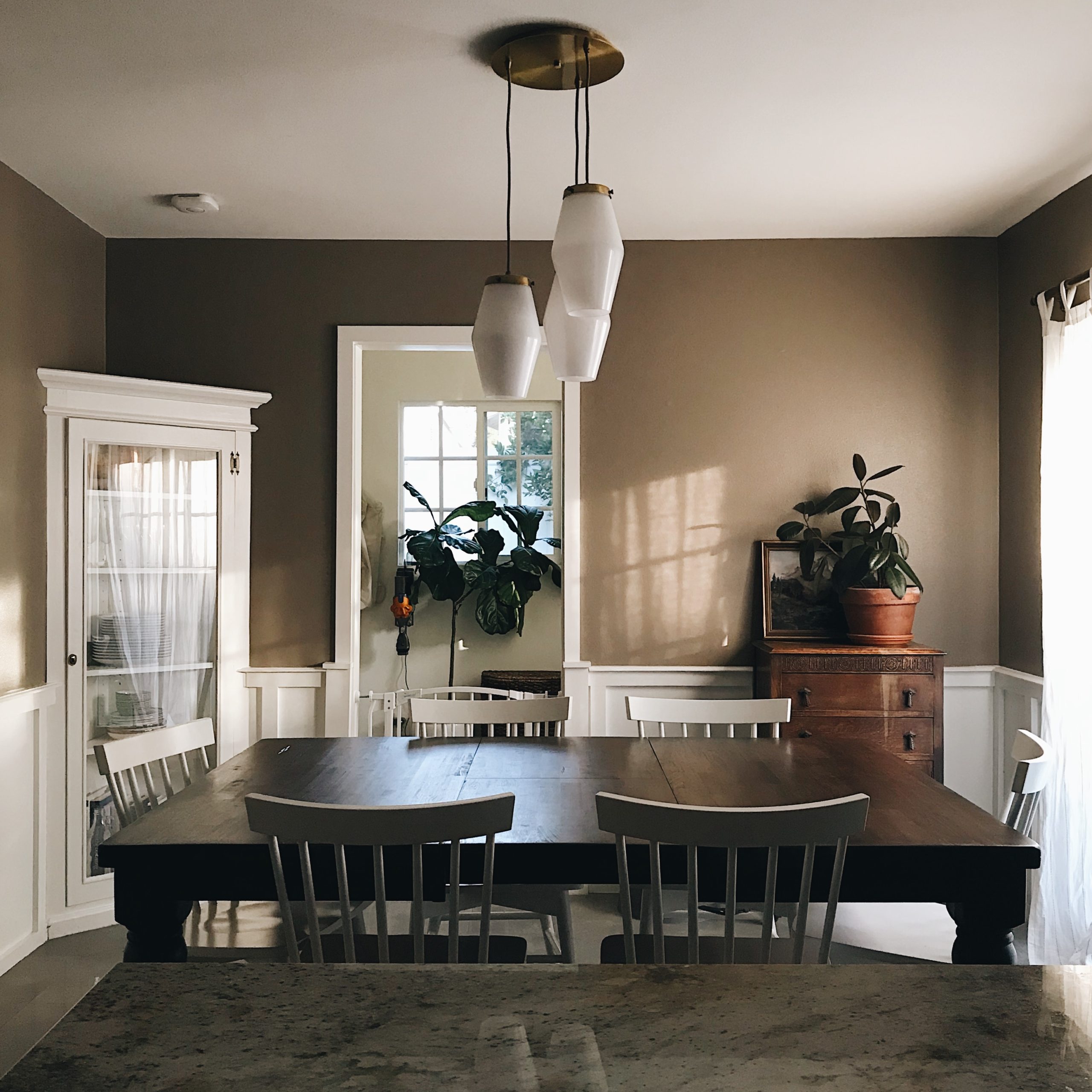 a dining room with a table and chairs