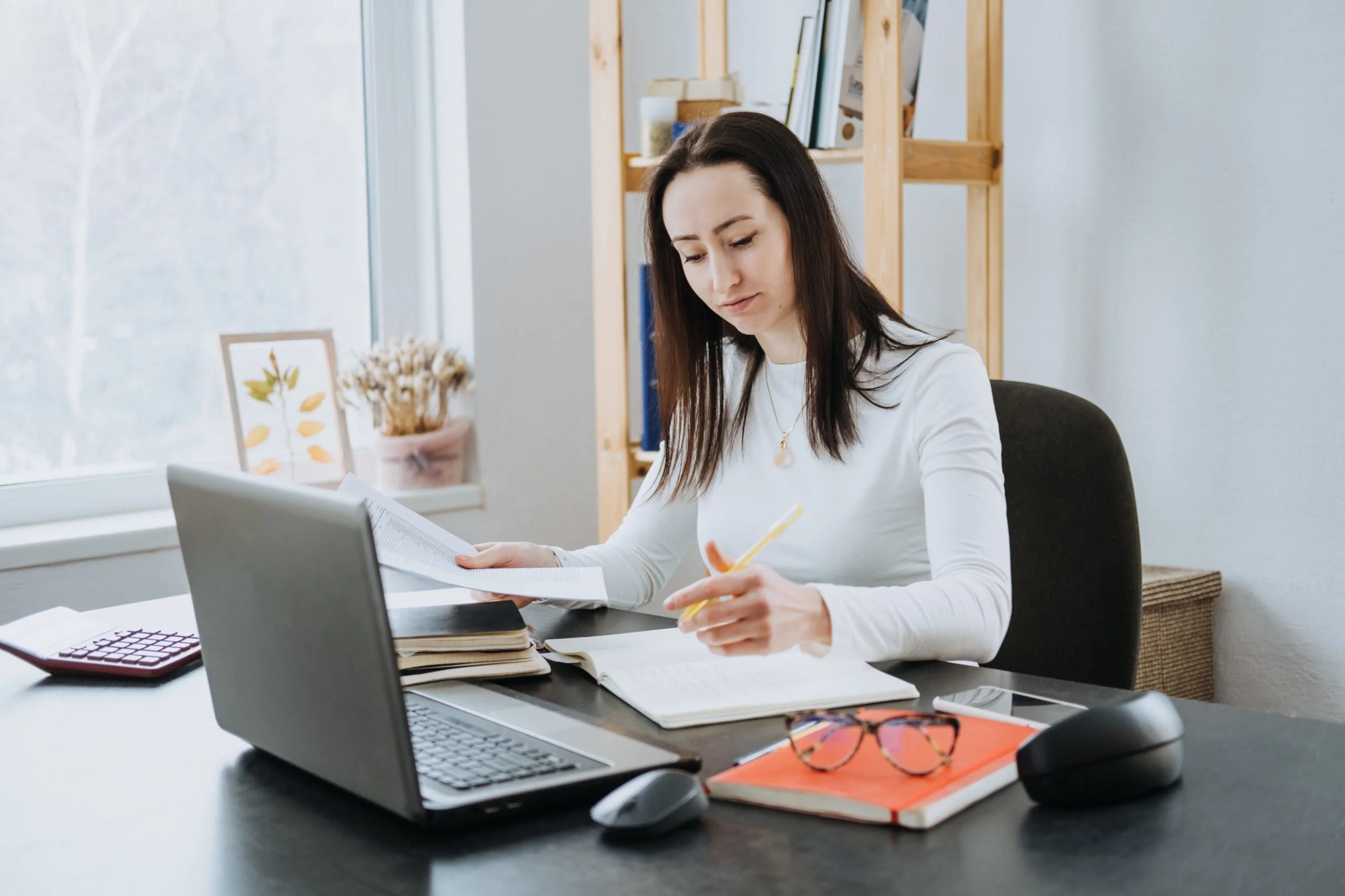 a woman sitting at a desk