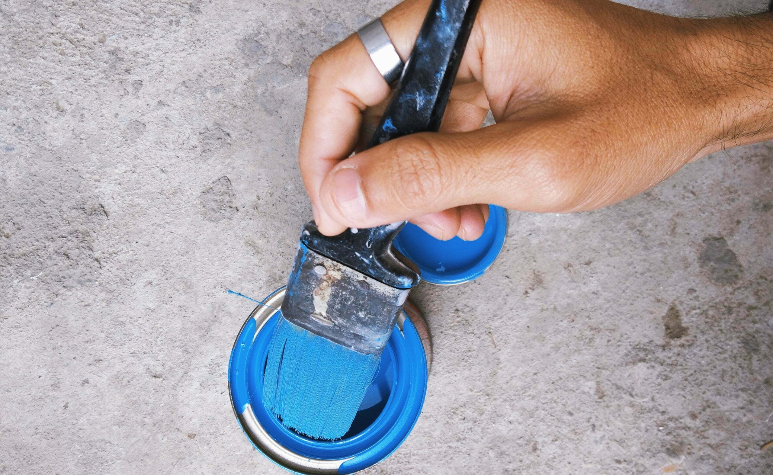 a person holding a blue shoe