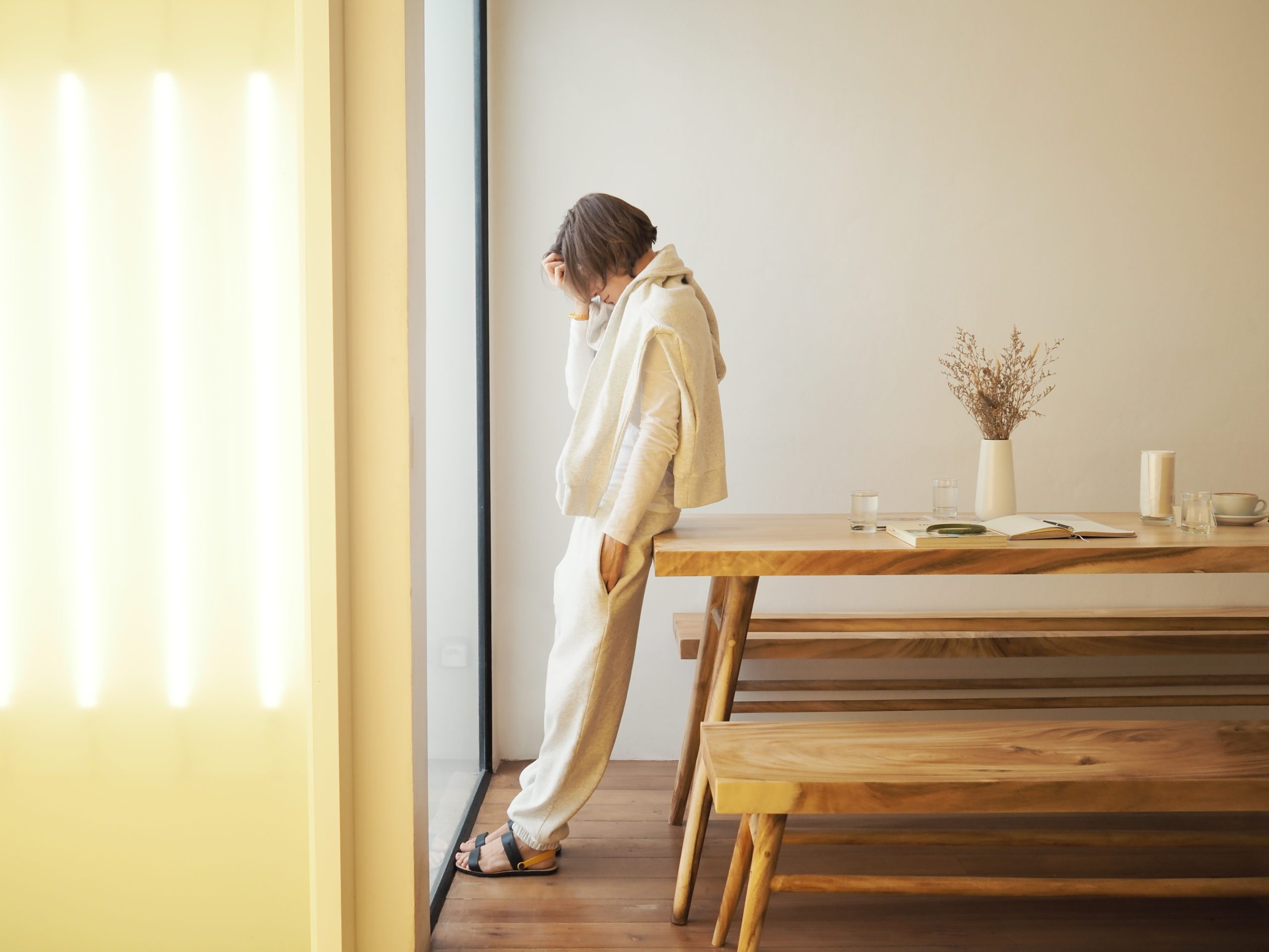 Sad woman near the window. Mental health